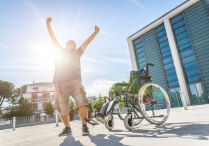 Man Rises from Wheelchair