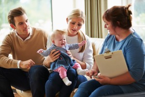 Social Worker Visiting Family With Young Baby