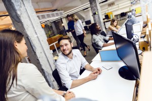 People working at busy modern office