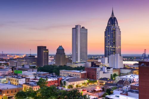 Alabama city skyline at sunset showing downtown buildings and urban counseling practice locations