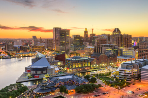 Maryland - Shutterstock | CareersinPsychology.org Baltimore Maryland Inner Harbor skyline at sunset, a major employment center for licensed social workers