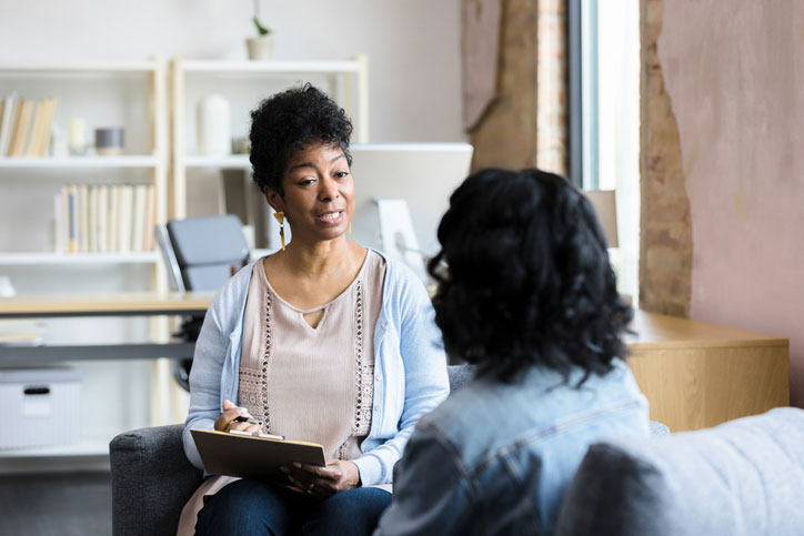 female therapist with young patient