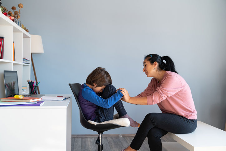 schoolboy talking with therapist