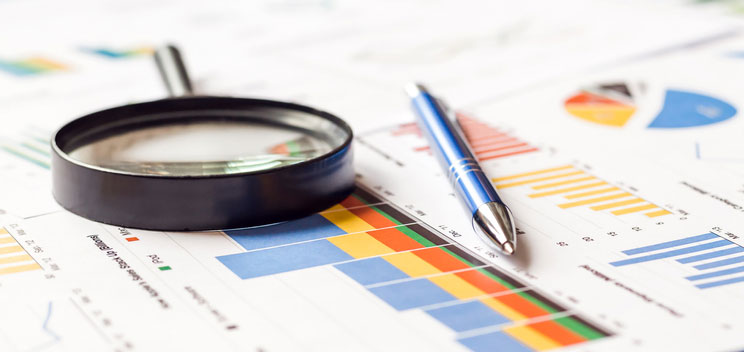 magnifier and charts on table